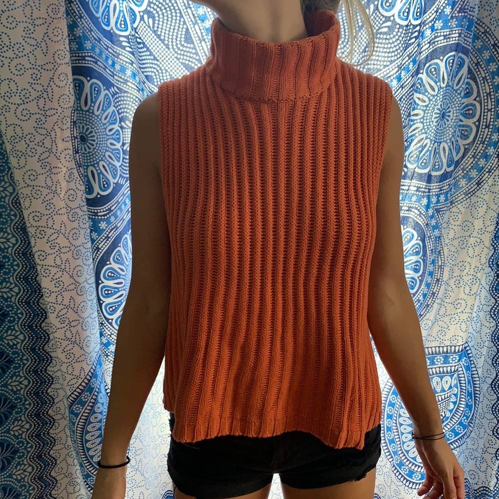 Ess orange armless turtleneck sweater. Medium